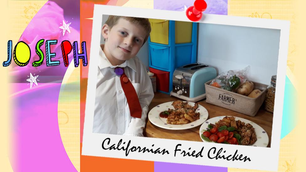 A little boy (Joseph) standing next to a countertop, displaying Californian Chicken.