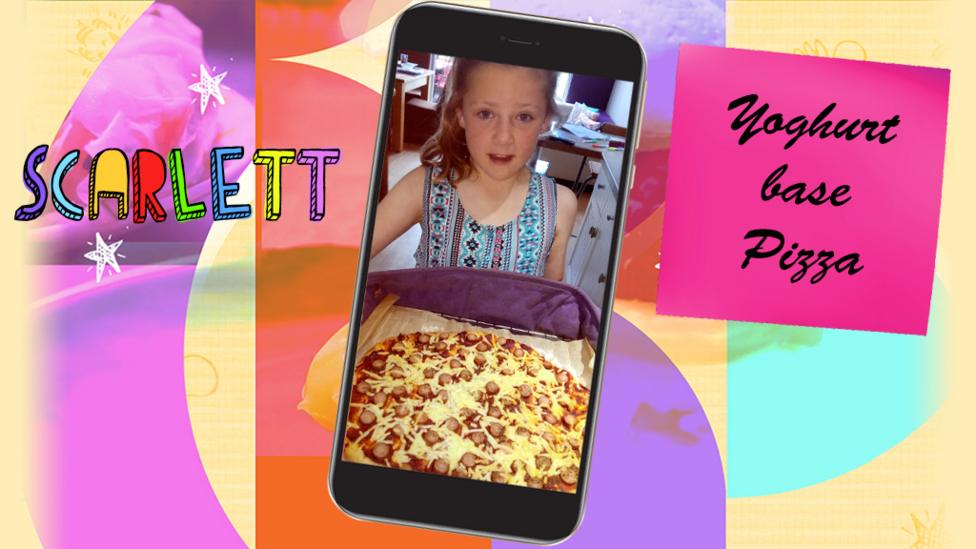 A little girl (Scarlett) smiling and with a plate containing a greek yoghurt based pizza.