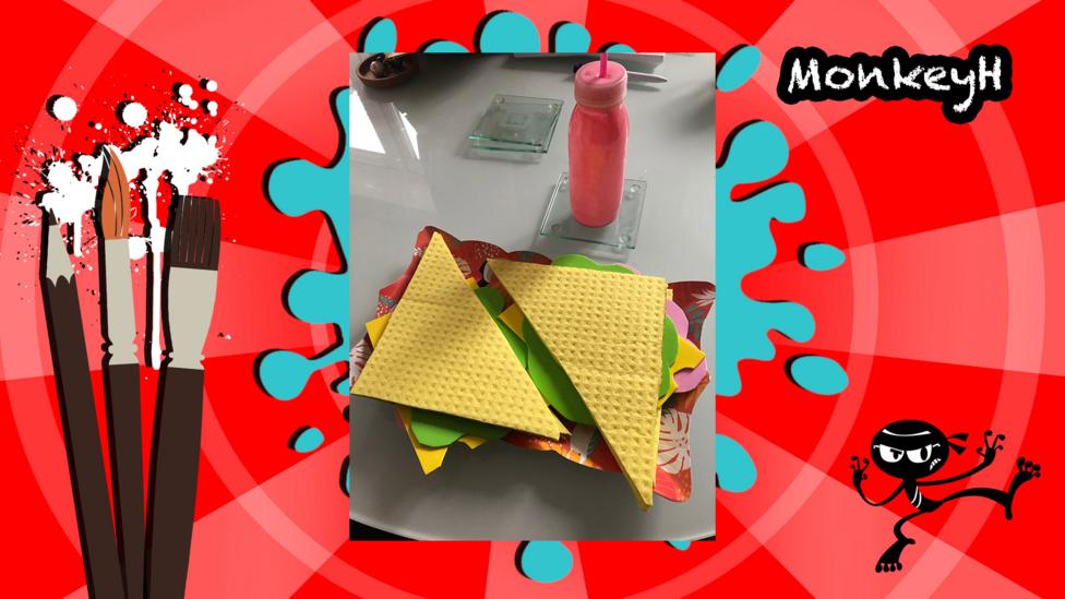 An art piece designed to look like a sandwich using various materials.