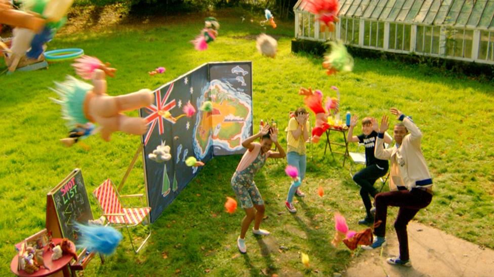 the family cover themselves from hundreds of plastic trolls