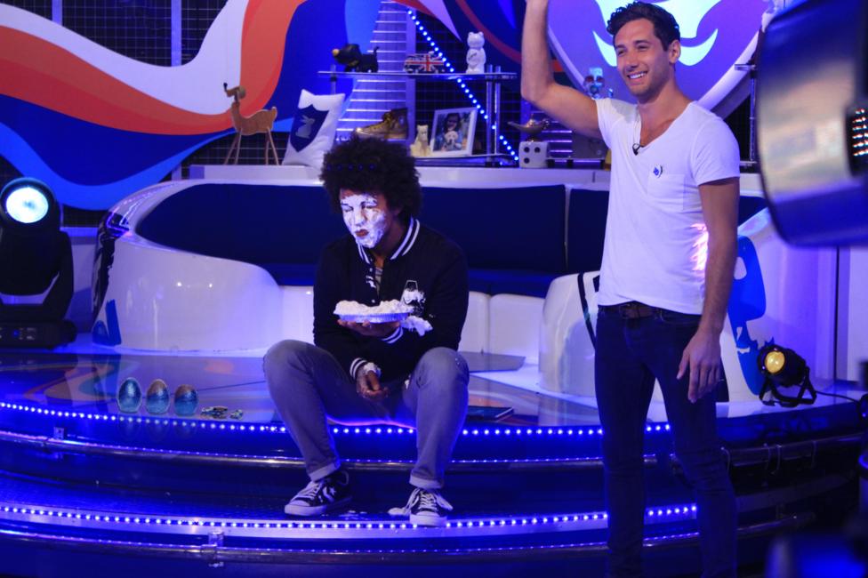 Radzi has pie on his face.