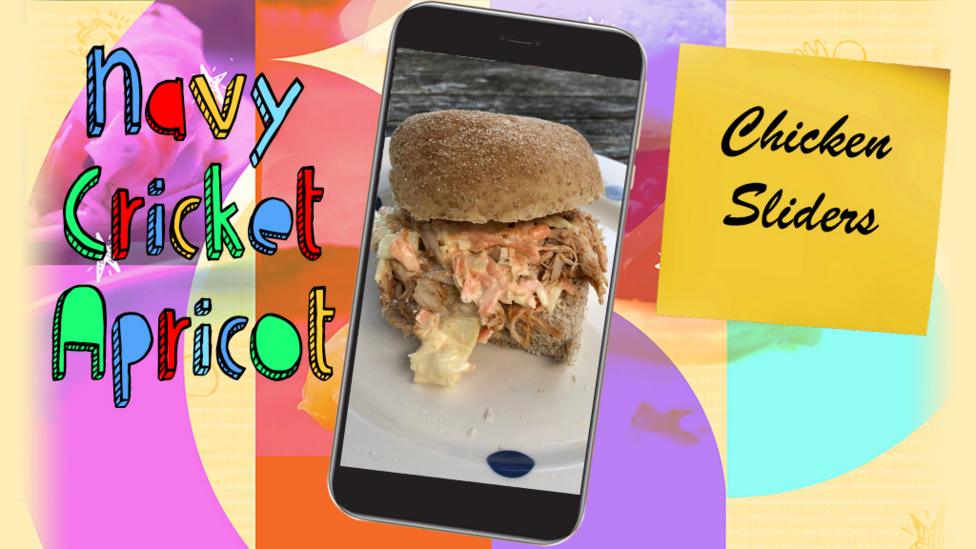 A plate with a chicken slider sandwich on it.