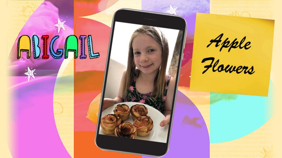 A young girl called Abigail shows the camera a plate of apple flowers.