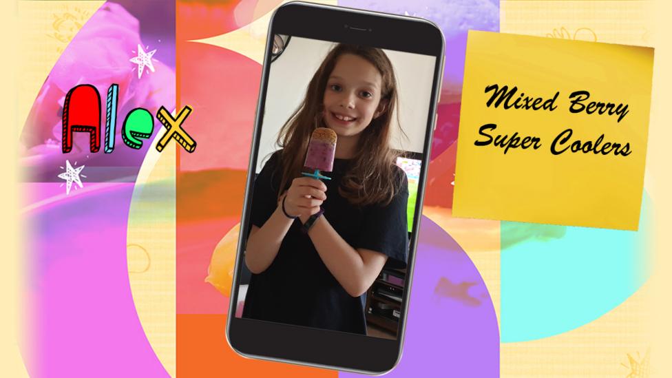 A girl (Alex) smiling and holding a berry fruit cooler.