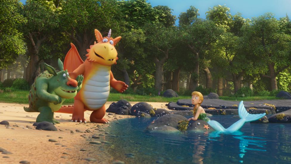 Zog is next to the lake talking to his friends the mermaid and the troll.