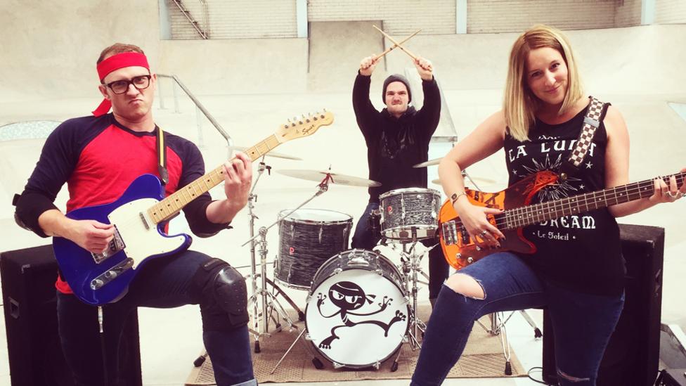 Ricky, Gav and Sarah posing with instruments.