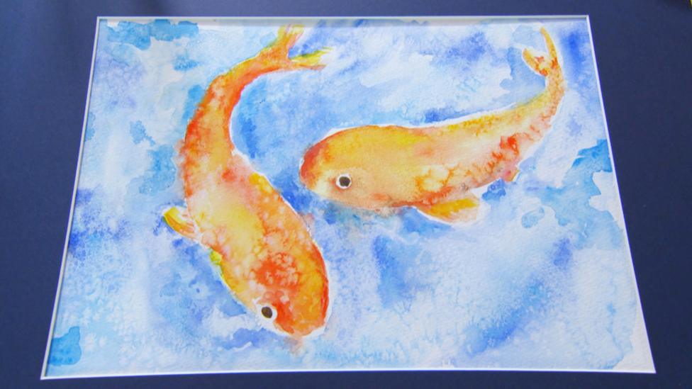 Watercolour painting of two fish.