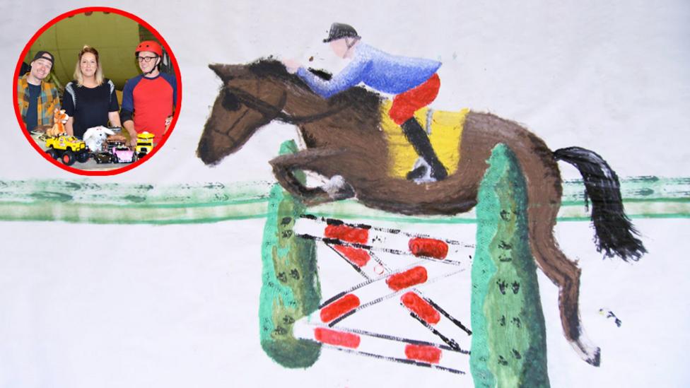 Large painting of a horse jumping over a fence.