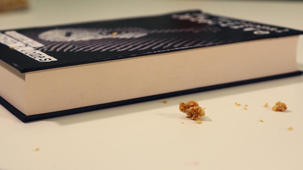 A book covered in crumbs.