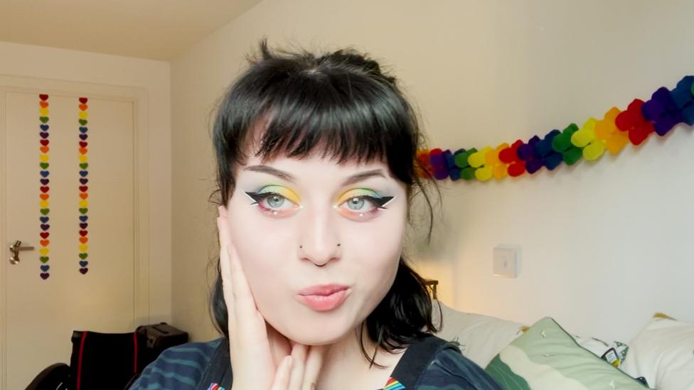 Blue Peter presenter Abby Cook poses to highlight her Pride inspired make up look.