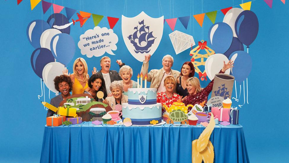 Blue Peter presenters partying around a table.