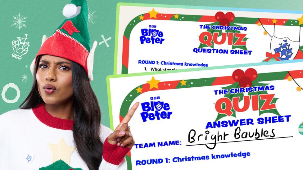 Shini points to the two Blue Peter Christmas Quiz print out papers.