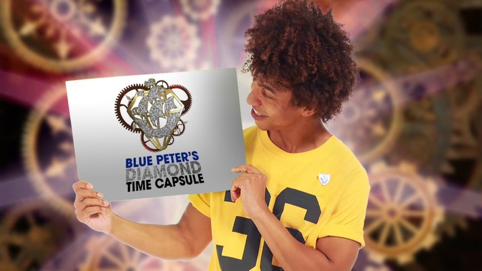Radzi holding a card saying Blue Peter's Diamond Time Capsule.