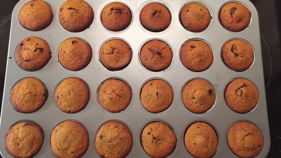 A tray of finished cupcakes.