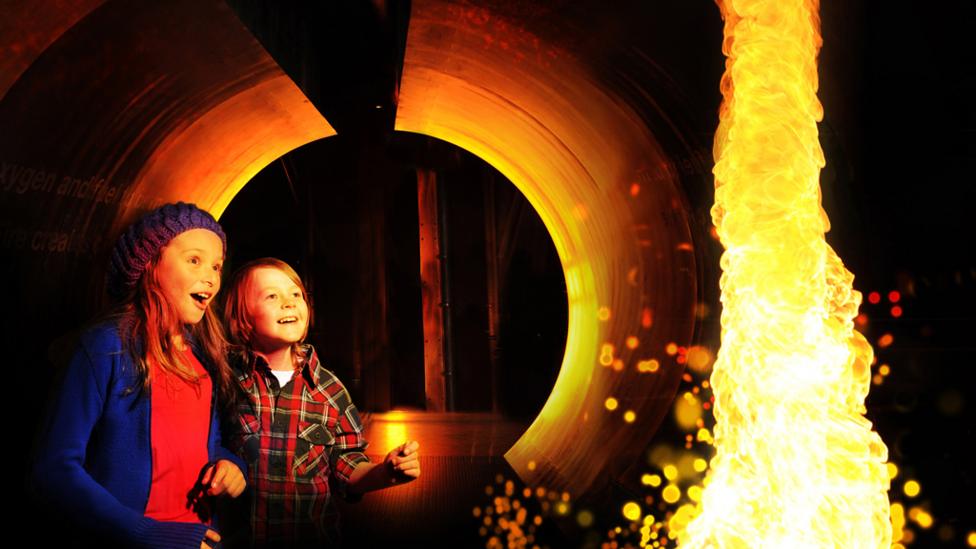 Children watching a molten waterfall