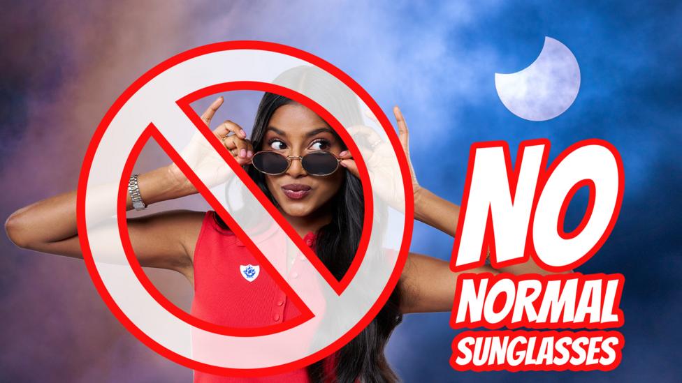 Shini wearing normal sunglasses with a cheeky expression, a big warning sign says no to wearing normal sunglasses for eclipse safety.