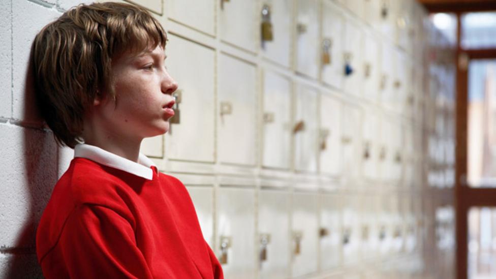 Boy looking sad at school.