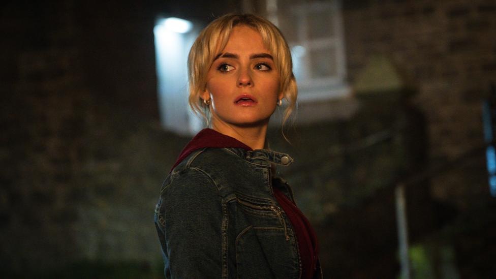 Ruby Sunday returns, she looks concerned at something off screen in a dramatic image.