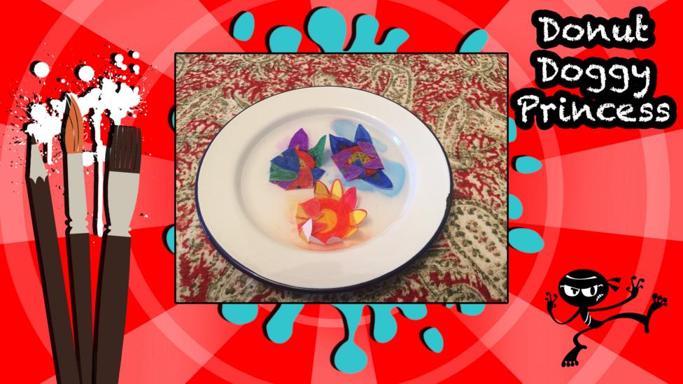 Self blooming flowers created using coloured paper. Made by username 'DonutDoggyPrincess'.