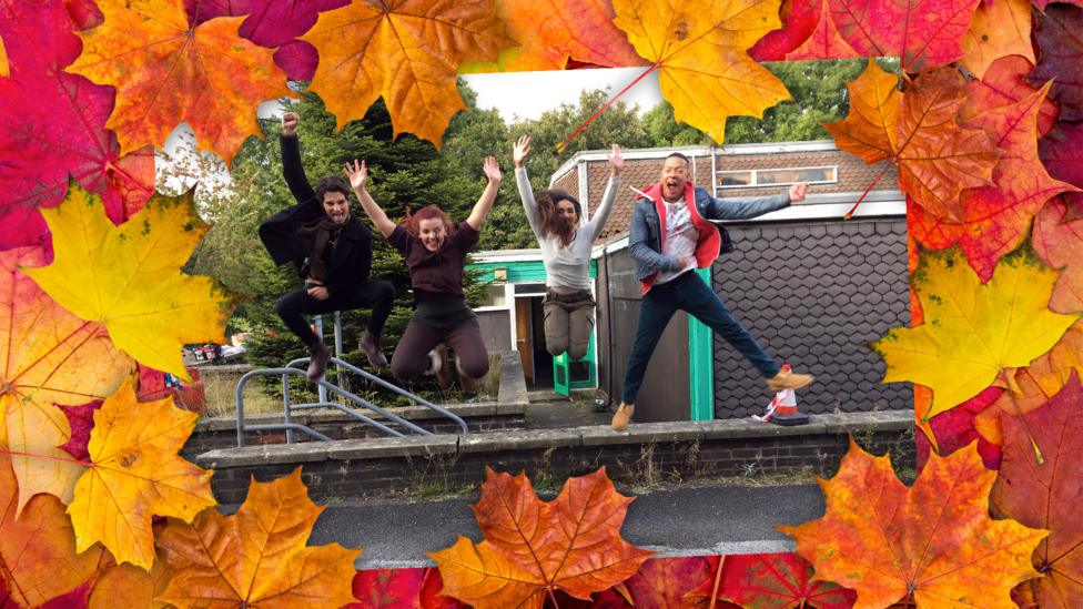 Photo of Wolfblood cast jumping into the air, surrounded bu autumnal leaves.