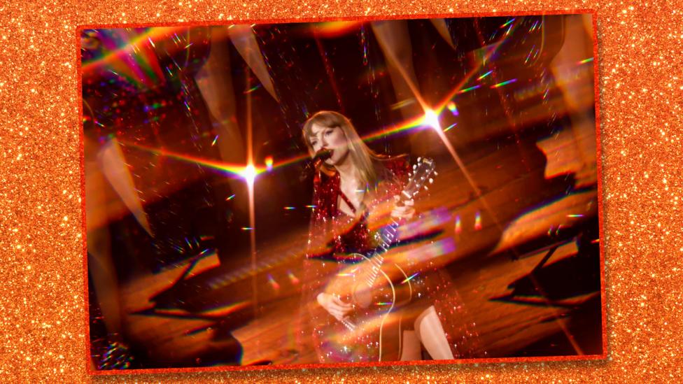 Taylor Swift performing at the Eras Tour, the image is very glittery.