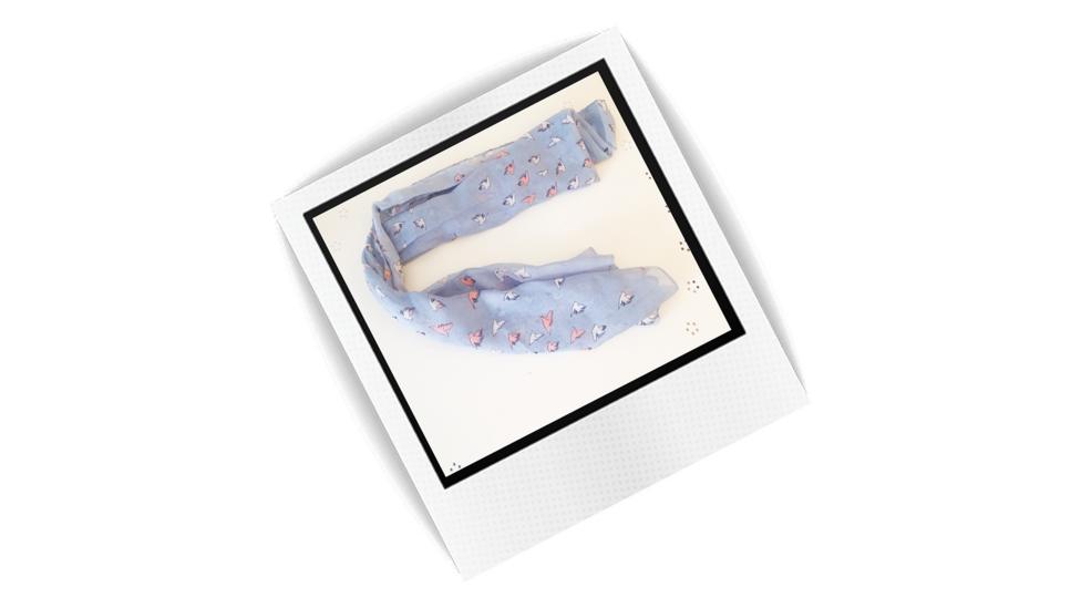 Polaroid style photo of a child's scarf.
