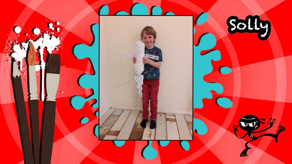 A child holding a ghost made from a bottle.