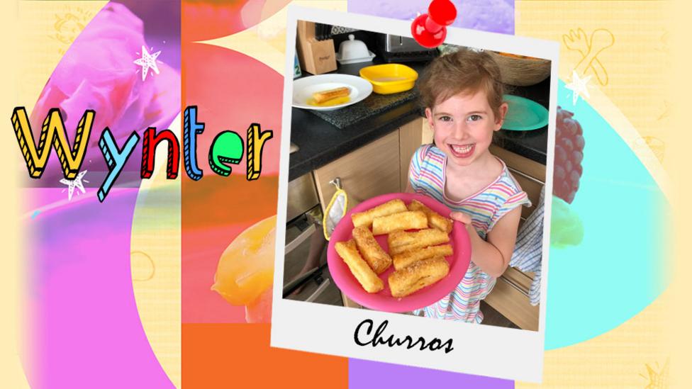 A girl holding a plate of churros that she had made.