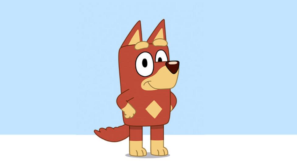 A cartoon Jack Russell terrier, with ruddy fur and a practical grin, standing on hind legs with front paws on hips.