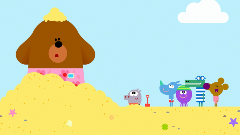 Duggee in sandcastle.