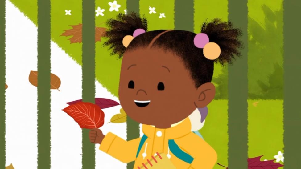 JoJo holding a leaf.