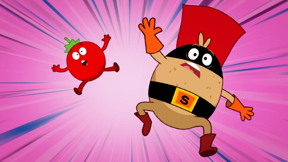 Image of a tomato and a potato dressed as a superhero falling through the air against a pink background.