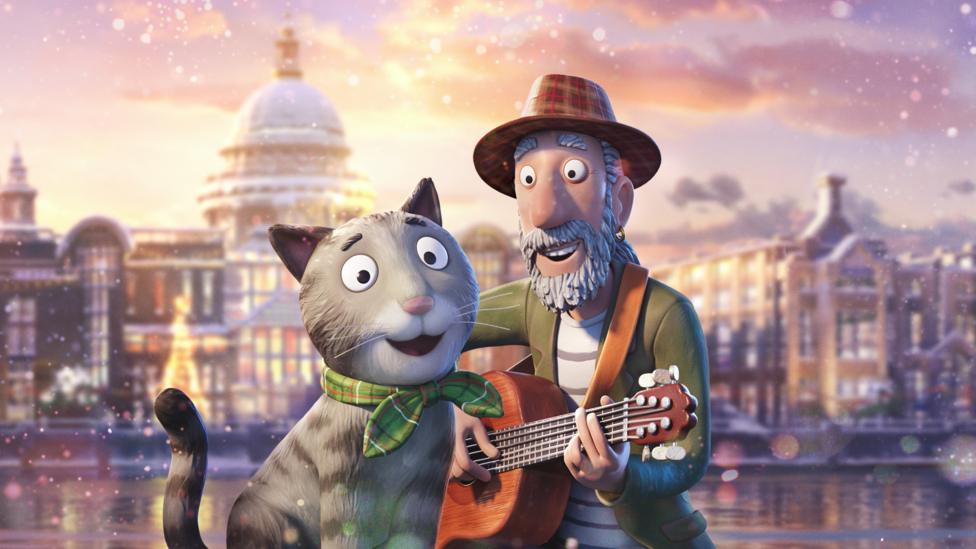 An animated scruffy man with a guitar and his tabby cat sit together on the streets of a sitting, smiling in the snow.