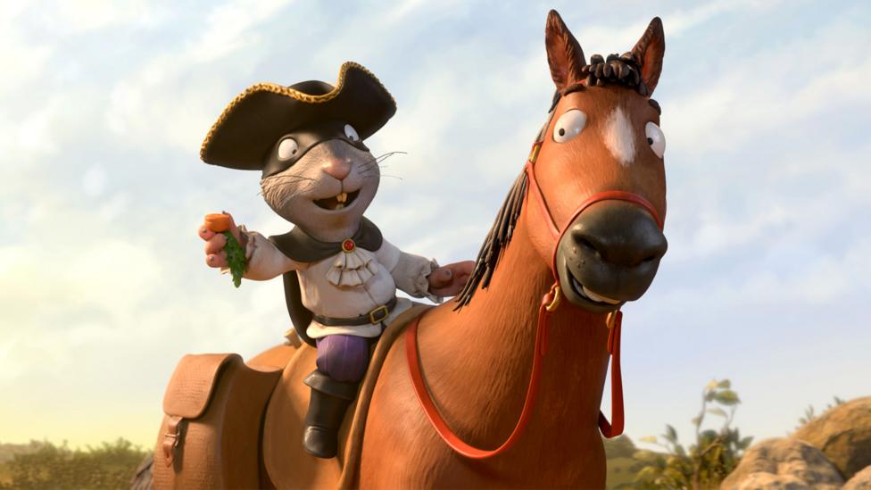 An animated rat in a highway man's clothing (black hat and mask with a rapier) sits atop of grinning horse.