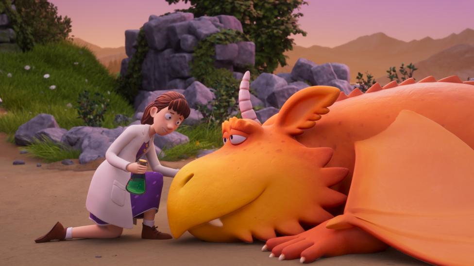 Image of Princess Pearl kneeling down to help Zog with a bottle of green medicine.