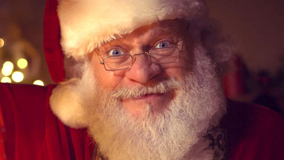 Father Christmas from Christmas Eve With Santa smiling with a hat on.