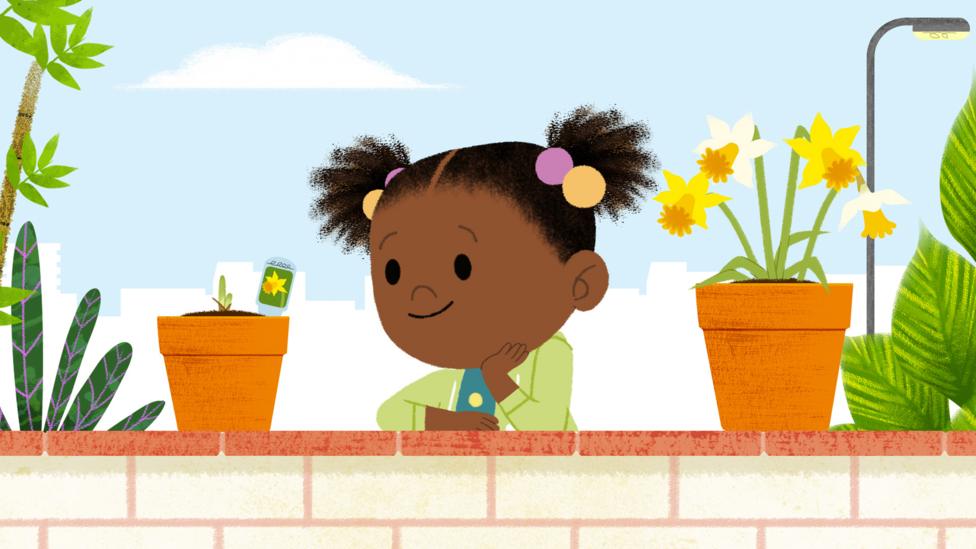 JoJo, wearing a green top looking at an orange flower pot