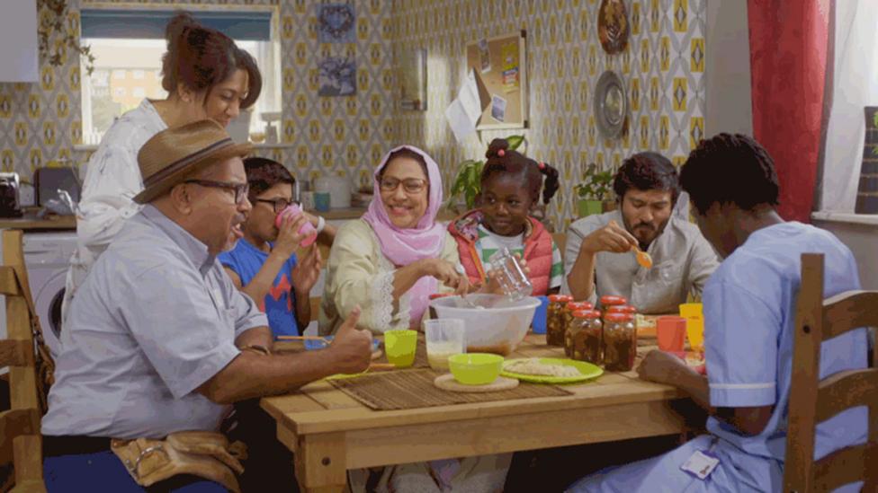 Apple Tree House family eating a meal around a table