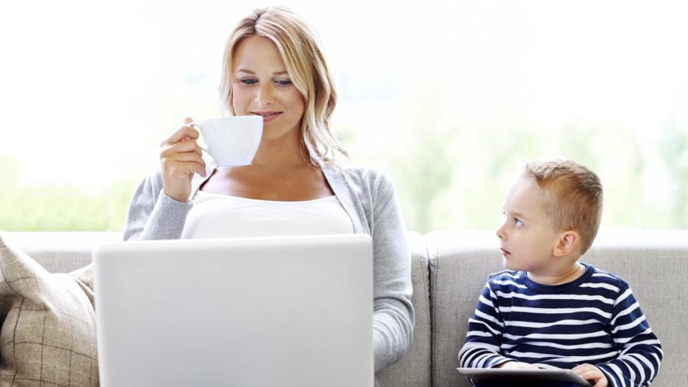 mother and child using laptop