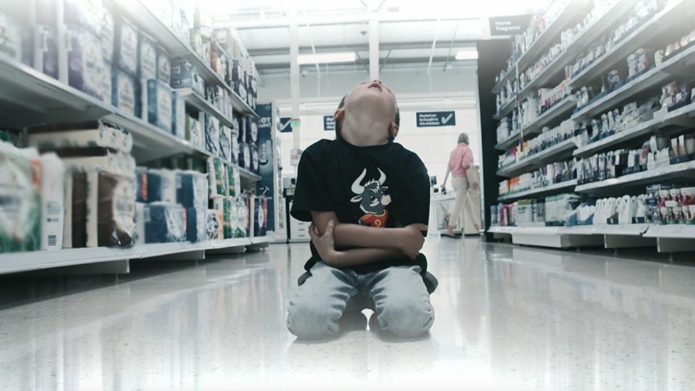Little boy in supermarket