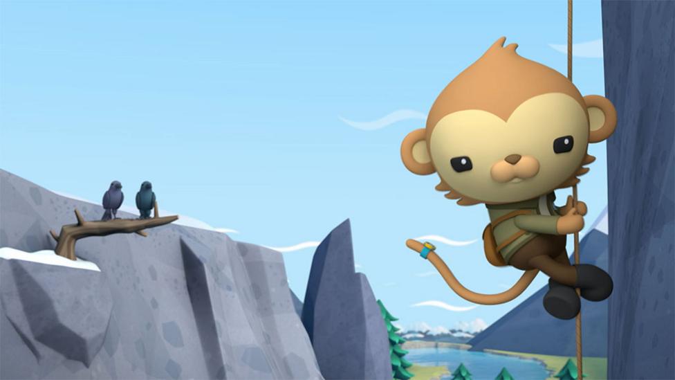 Octo-agent Paani hanging on rope on cliff.