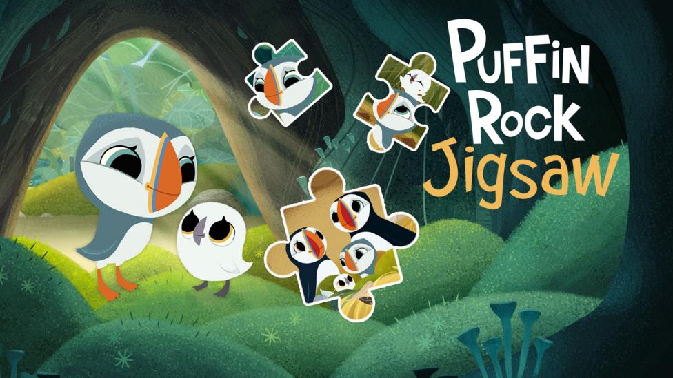 Oona and Baba, two young puffin chicks are cosy in a mossy cave.