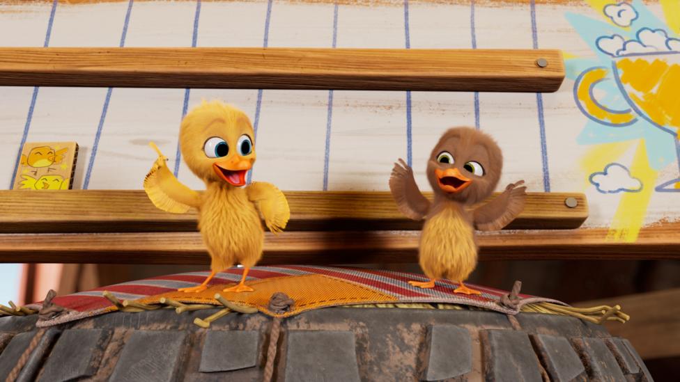 Spicy and Sunny ducklings dance on top of a tyre in the barn.