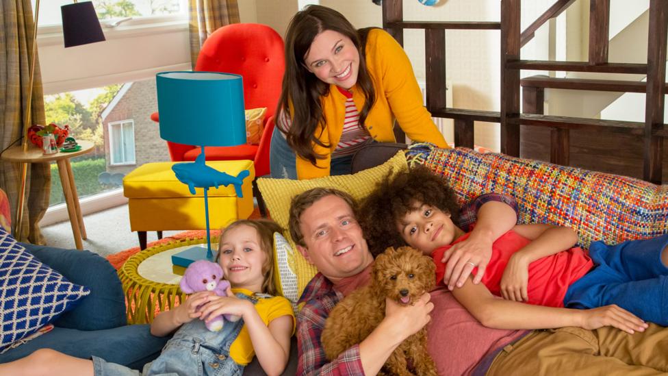 The Brooklyn-Bell family from Waffle the Wonder Dog smiling at the camera