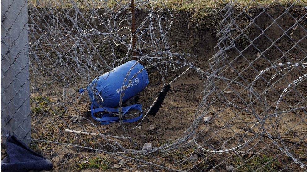 A part of the damaged border fence near the border village of Roszke, Hungary, 9 February 2016