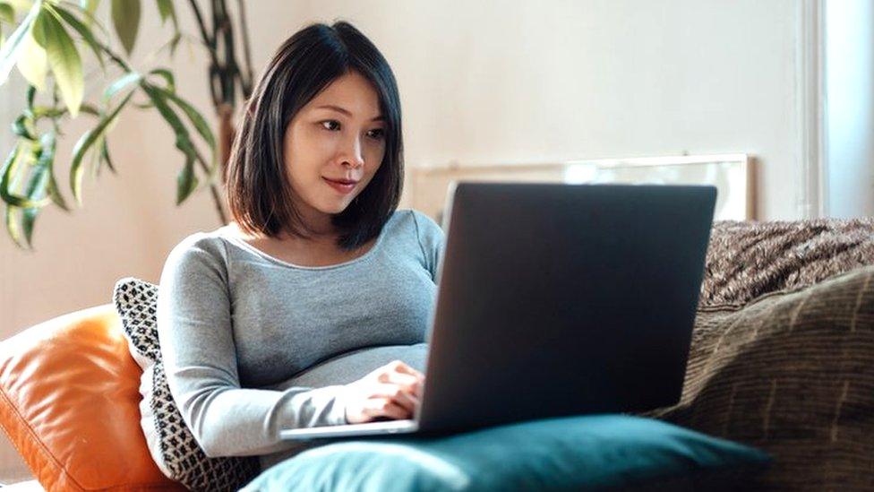 Woman working from home - stock shot