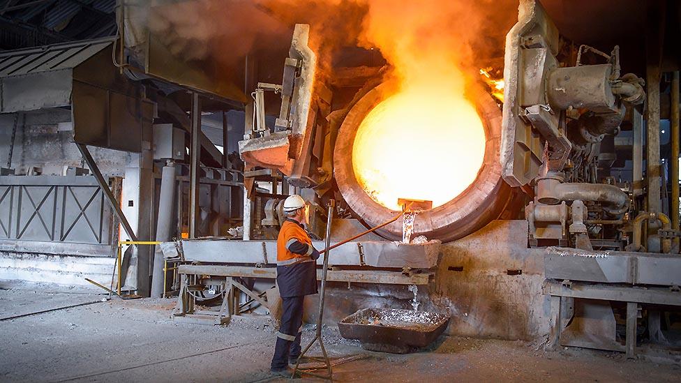 A worker with an aluminium smelter