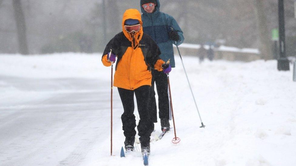 Skiers explore the fresh snow in New York's Central Park