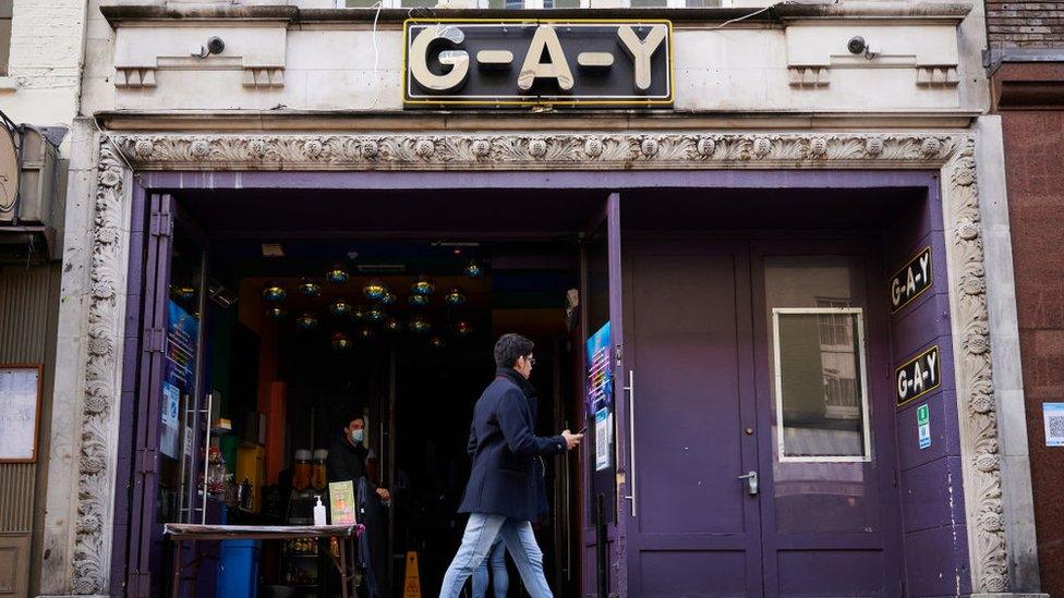 A man walks past the "G-A-Y" bar and venue on 5 October 2020