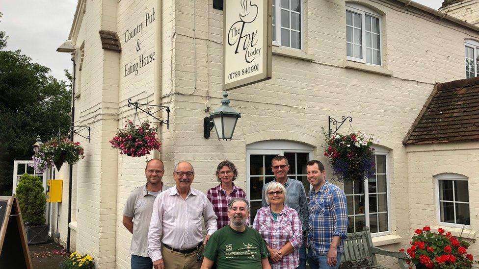 Action group outside the pub